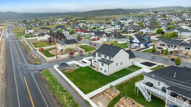 aerial view featuring a mountain view and a residential view