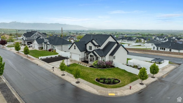 bird's eye view featuring a residential view and a mountain view
