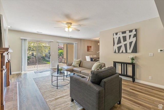 2568 S Elizabeth St Unit 5, Salt Lake City, UT 84106 - living area featuring a ceiling fan, baseboards, and wood finished floors