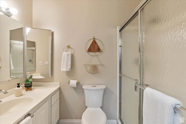 2568 S Elizabeth St Unit 5, Salt Lake City, UT 84106 - bathroom with a stall shower, baseboards, vanity, and toilet