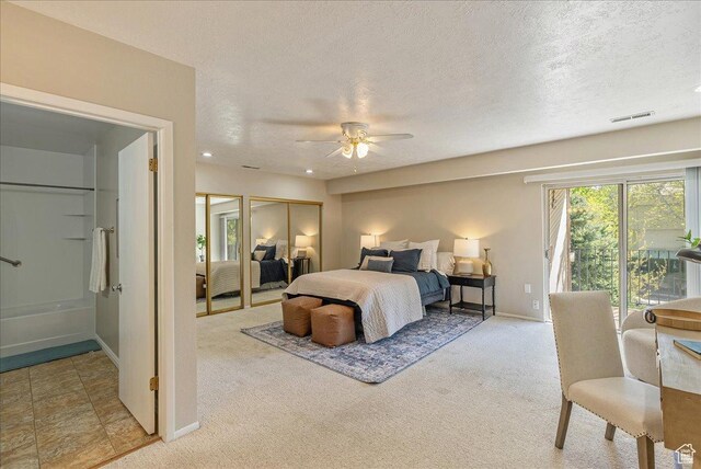 2568 S Elizabeth St Unit 5, Salt Lake City, UT 84106 - carpeted bedroom featuring a textured ceiling, baseboards, visible vents, ceiling fan, and access to outside
