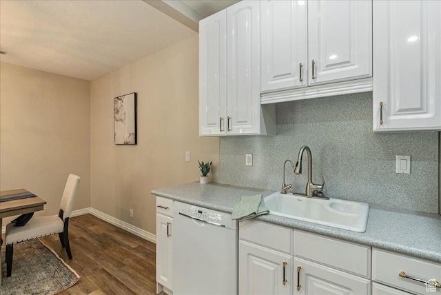 2568 S Elizabeth St Unit 5, Salt Lake City, UT 84106 - kitchen featuring a sink, dark wood finished floors, dishwasher, decorative backsplash, and light countertops