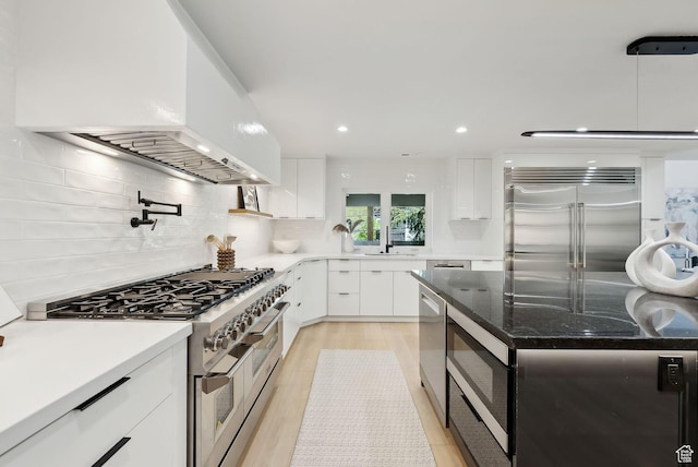 3520 S Westwood Dr E, Millcreek, UT 84109 - kitchen featuring white cabinets, built in appliances, modern cabinets, tasteful backsplash, and custom range hood