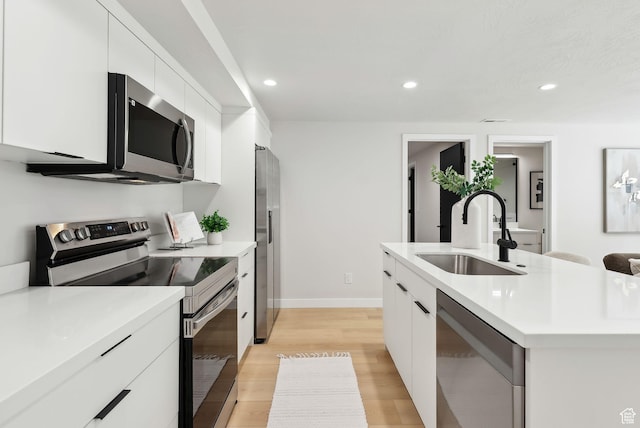 3520 S Westwood Dr E, Millcreek, UT 84109 - kitchen with a sink, stainless steel appliances, recessed lighting, white cabinets, and modern cabinets