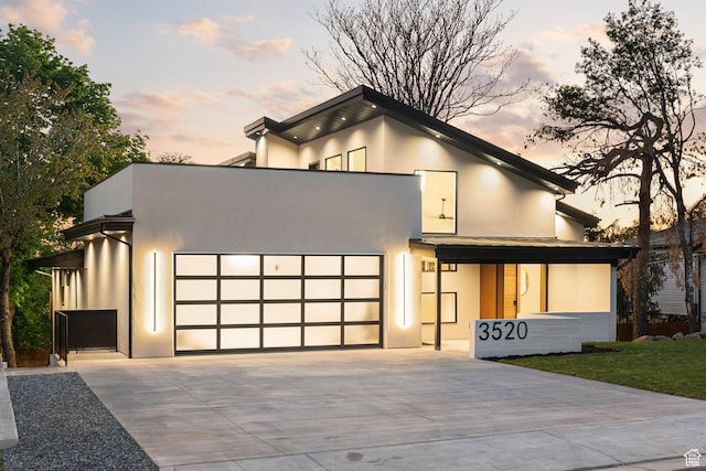 3520 S Westwood Dr E, Millcreek, UT 84109 - modern home with driveway, stucco siding, and an attached garage