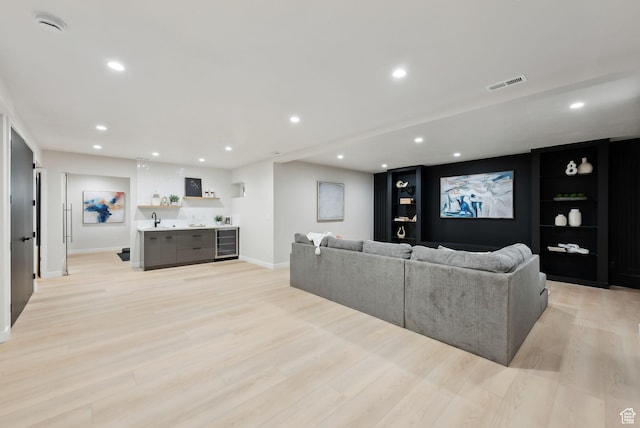 3520 S Westwood Dr E, Millcreek, UT 84109 - living area featuring light wood-style flooring, recessed lighting, beverage cooler, baseboards, and visible vents