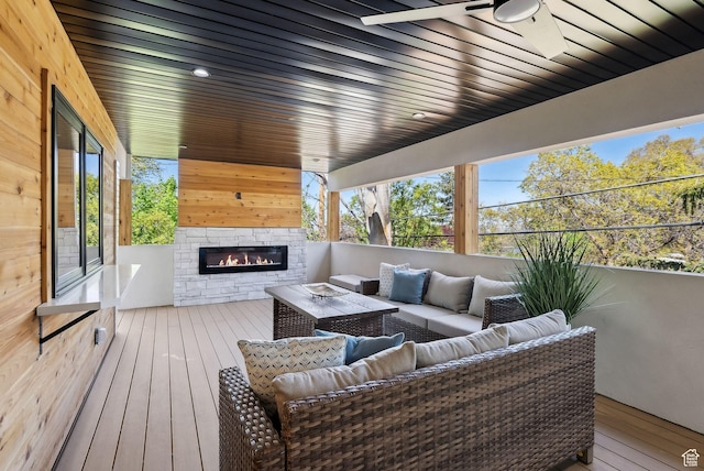 3520 S Westwood Dr E, Millcreek, UT 84109 - deck with an outdoor living space with a fireplace