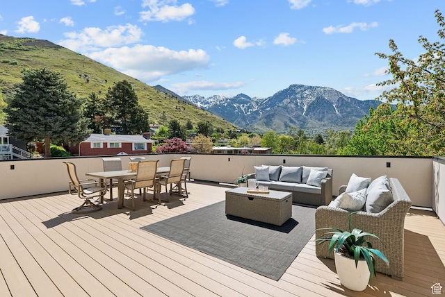 3520 S Westwood Dr E, Millcreek, UT 84109 - deck with outdoor dining area, an outdoor living space, and a mountain view