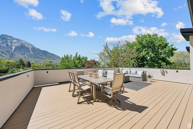 3520 S Westwood Dr E, Millcreek, UT 84109 - deck featuring outdoor dining area, outdoor lounge area, and a mountain view