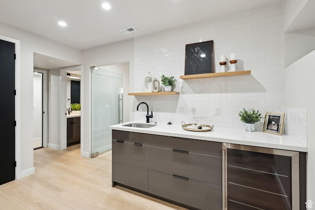 3520 S Westwood Dr E, Millcreek, UT 84109 - bar featuring a sink, wine cooler, wet bar, visible vents, and light wood finished floors