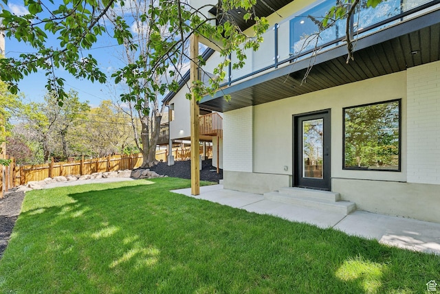 3520 S Westwood Dr E, Millcreek, UT 84109 - view of yard featuring a fenced backyard and a balcony