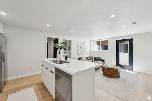 3520 S Westwood Dr E, Millcreek, UT 84109 - kitchen with a sink, a center island with sink, modern cabinets, light countertops, and dishwasher