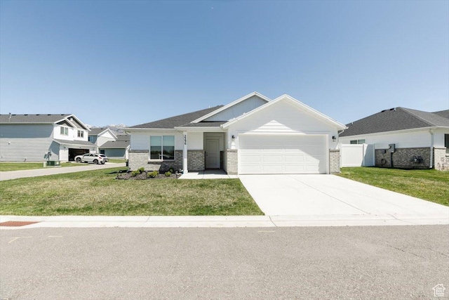 2396 N 150 E, North Logan, UT 84341 - single story home with driveway, an attached garage, brick siding, and a front yard