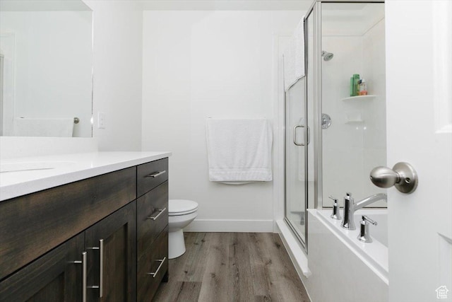 2396 N 150 E, North Logan, UT 84341 - bathroom with a shower with shower door, wood finished floors, vanity, baseboards, and a bath