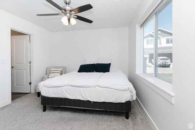 2396 N 150 E, North Logan, UT 84341 - carpeted bedroom with multiple windows, baseboards, and ceiling fan