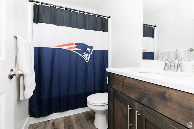 2396 N 150 E, North Logan, UT 84341 - bathroom featuring vanity, toilet, a shower with curtain, and wood finished floors