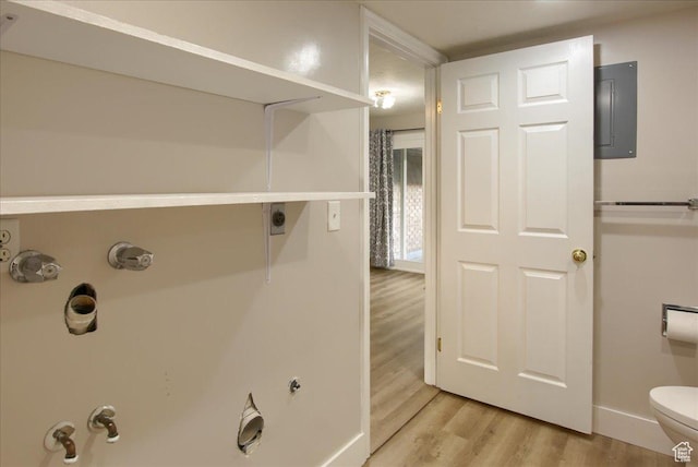 571 N 200 W, Bountiful, UT 84010 - bathroom with electric panel, toilet, baseboards, and wood finished floors