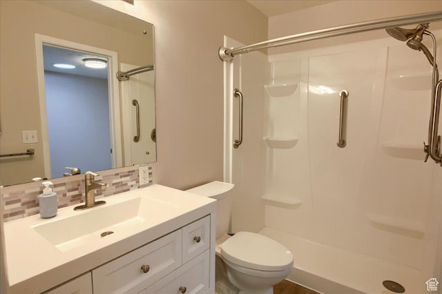 571 N 200 W, Bountiful, UT 84010 - full bath with a stall shower, vanity, toilet, and decorative backsplash
