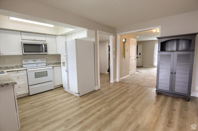 571 N 200 W, Bountiful, UT 84010 - kitchen with baseboards, white appliances, light wood-style flooring, and white cabinets