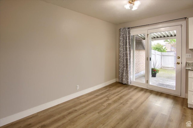 571 N 200 W, Bountiful, UT 84010 - unfurnished room with baseboards and light wood-type flooring