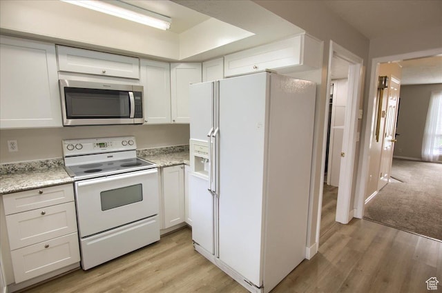 571 N 200 W, Bountiful, UT 84010 - kitchen with white cabinetry, light wood-style flooring, and white appliances