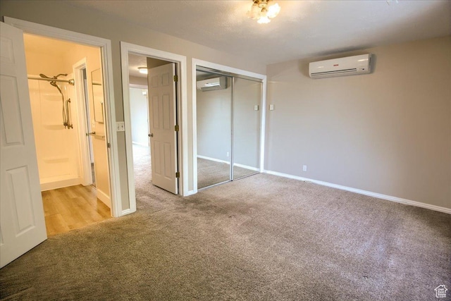 571 N 200 W, Bountiful, UT 84010 - unfurnished bedroom with carpet, a closet, baseboards, and an AC wall unit