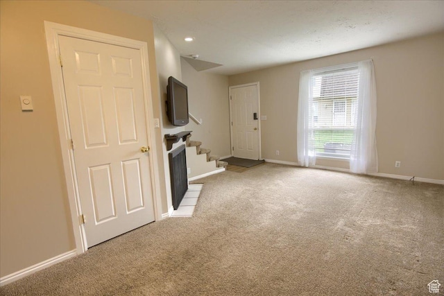 571 N 200 W, Bountiful, UT 84010 - unfurnished living room featuring baseboards, stairway, and carpet