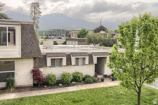 571 N 200 W, Bountiful, UT 84010 - view of front of house featuring a front yard, a shingled roof, and a mountain view