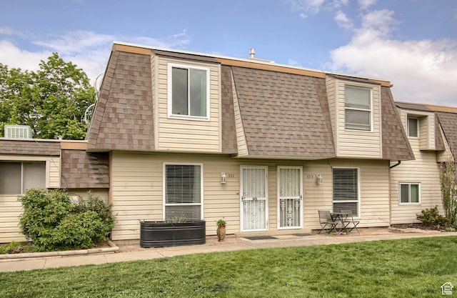571 N 200 W, Bountiful, UT 84010 - back of property with a shingled roof, mansard roof, a yard, and a patio area