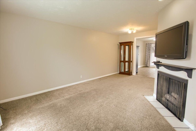 571 N 200 W, Bountiful, UT 84010 - unfurnished living room featuring light carpet, baseboards, and a fireplace with flush hearth