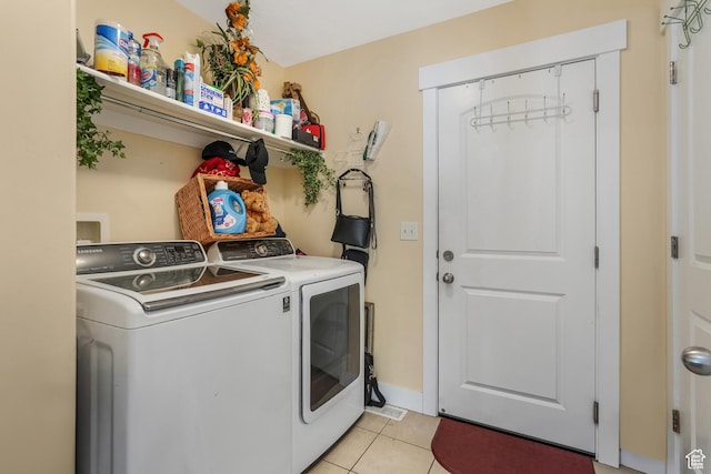 4999 W Tobago Ln, Herriman, UT 84096 - laundry room with washing machine and clothes dryer, laundry area, and light tile patterned flooring
