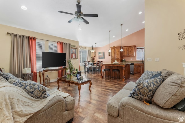 4999 W Tobago Ln, Herriman, UT 84096 - living room featuring vaulted ceiling, ceiling fan, plenty of natural light, and wood finished floors