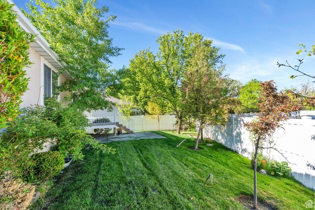 12532 S Blacksmith Ln, Draper, UT 84020 - view of yard featuring a patio and a fenced backyard