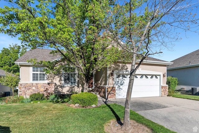 12532 S Blacksmith Ln, Draper, UT 84020 - view of property hidden behind natural elements featuring an attached garage, stone siding, driveway, stucco siding, and a front lawn