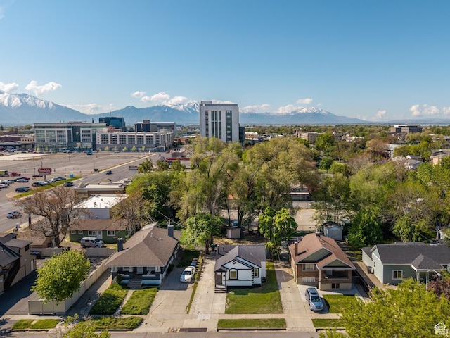 birds eye view of property with a mountain view