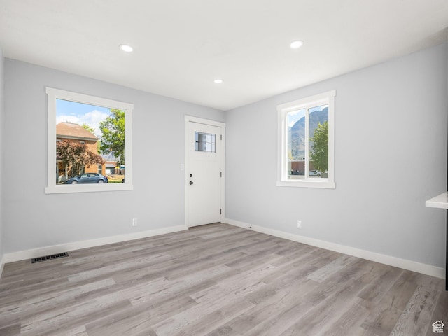 interior space featuring plenty of natural light, baseboards, and recessed lighting