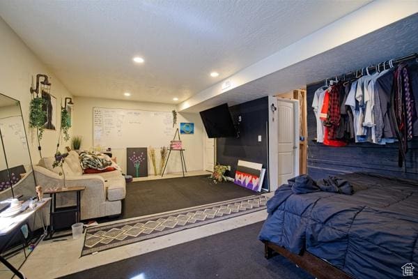 carpeted bedroom with recessed lighting