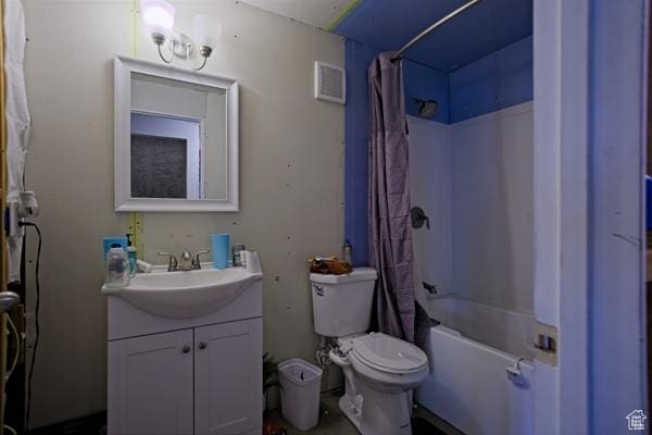 full bathroom featuring toilet, vanity, visible vents, and shower / bath combo