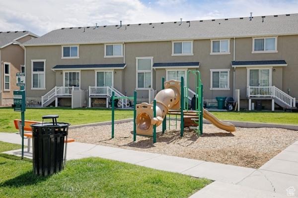 community play area featuring a lawn