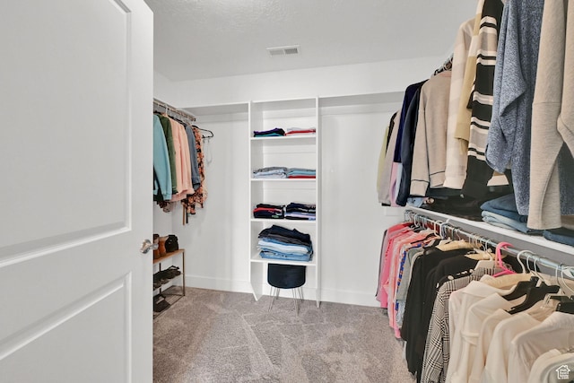 spacious closet featuring carpet floors and visible vents