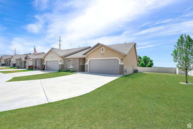 single story home featuring fence, a garage, stucco siding, concrete driveway, and a front yard