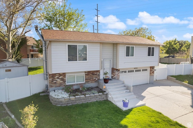 4990 S Hensley Cir, Taylorsville, UT 84129 - raised ranch featuring a gate, a garage, concrete driveway, a front lawn, and brick siding
