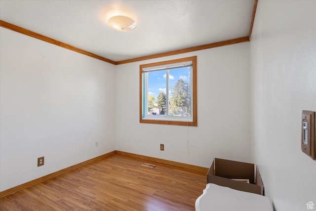 4990 S Hensley Cir, Taylorsville, UT 84129 - empty room with ornamental molding, baseboards, visible vents, and wood finished floors
