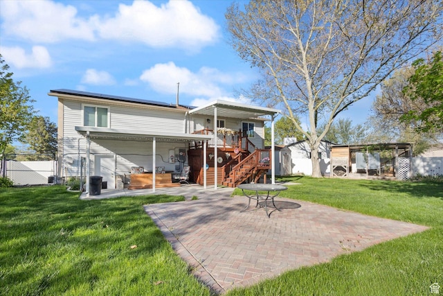 4990 S Hensley Cir, Taylorsville, UT 84129 - rear view of property with a yard, fence, stairs, a patio area, and a wooden deck