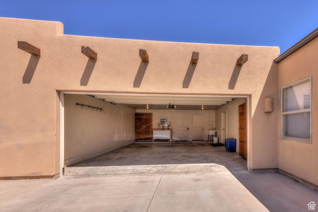 3686 S Spanish Valley Dr Unit K-2, Moab, UT 84532 - doorway to property featuring driveway, a patio, and stucco siding