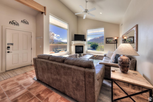 3686 S Spanish Valley Dr Unit K-2, Moab, UT 84532 - living area featuring vaulted ceiling, tile patterned flooring, a ceiling fan, and a glass covered fireplace