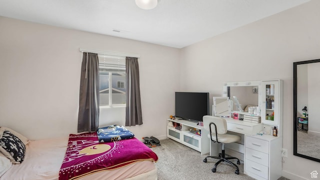 bedroom featuring baseboards, visible vents, and carpet floors