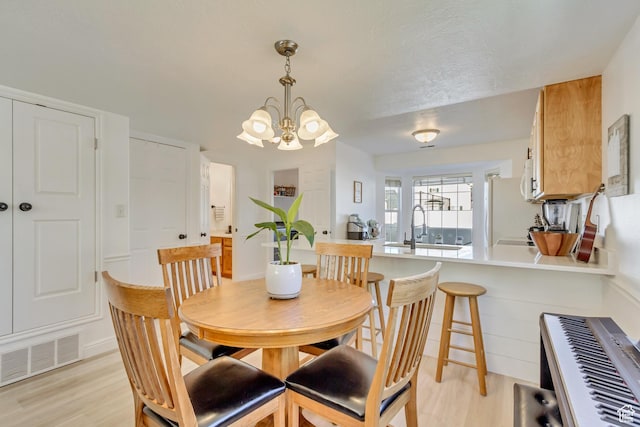 747 N 200 E, Springville, UT 84663 - dining space with an inviting chandelier, visible vents, and light wood-style floors