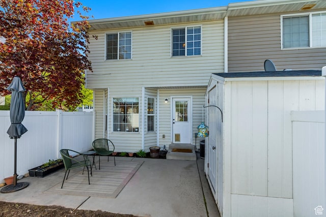 747 N 200 E, Springville, UT 84663 - rear view of property with a patio area, board and batten siding, entry steps, and fence