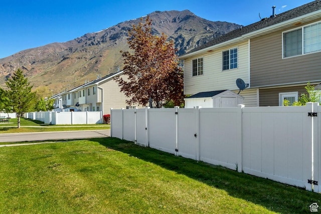 747 N 200 E, Springville, UT 84663 - view of side of home with fence, a residential view, a mountain view, and a lawn